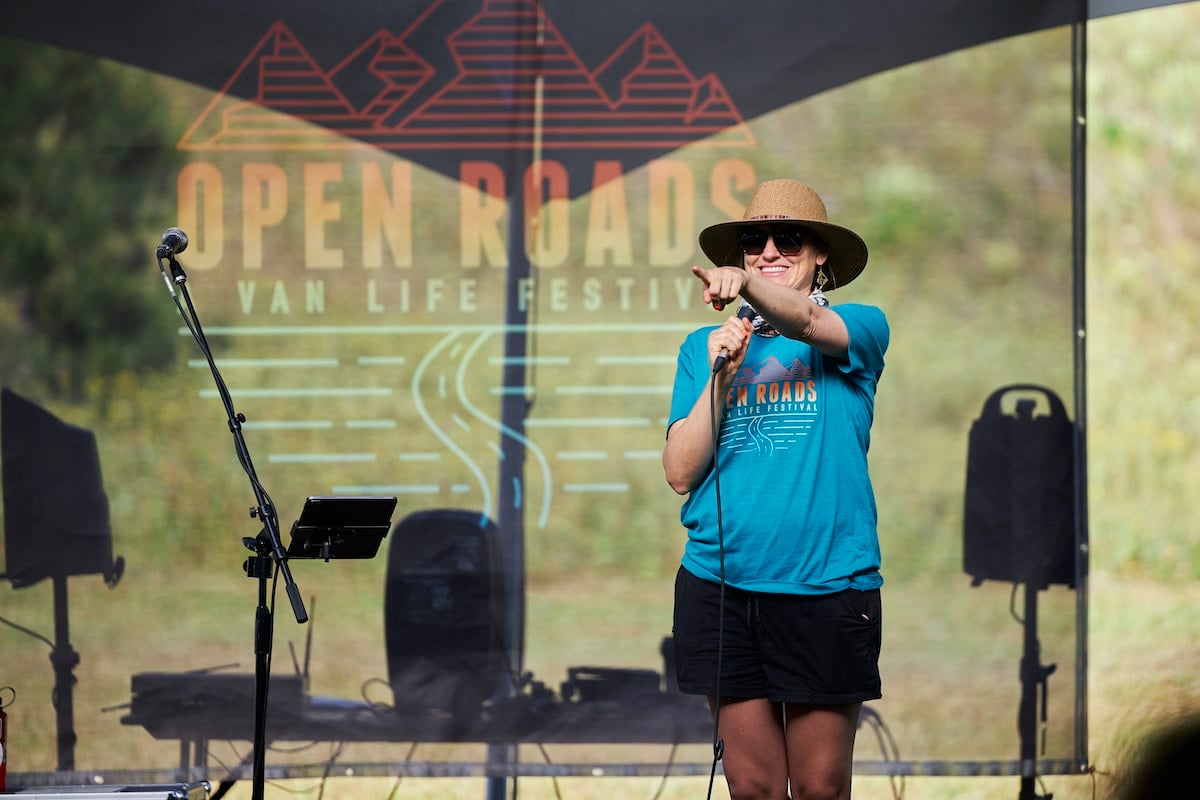 Kristen Bor speaking on stage at Open Roads Fest